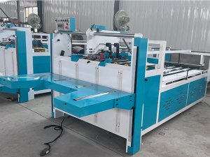 Semi-automatic box sticking machine